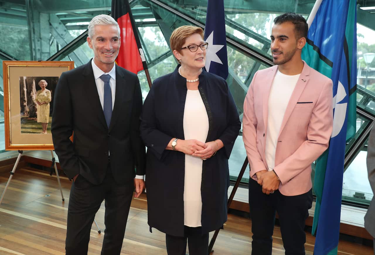 Former Socceroo Craig Foster, Minister for Foreign Affairs Marise Payne and refugee footballer Hakeem Al-Araibi at his citizenship ceremony.