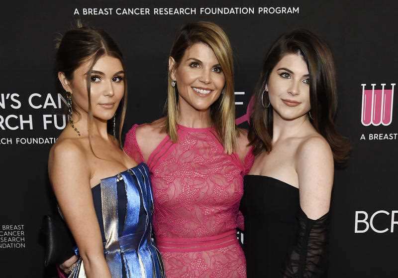 Actress Lori Loughlin, center, poses with daughters Olivia Jade Giannulli, left, and Isabella Rose Giannulli.