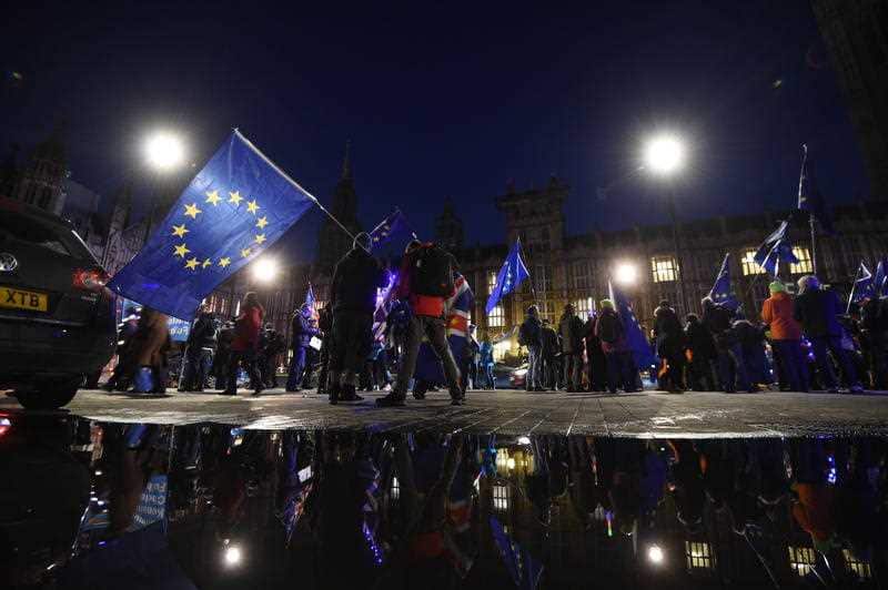 Pro-remain protesters rally outside parliament in London