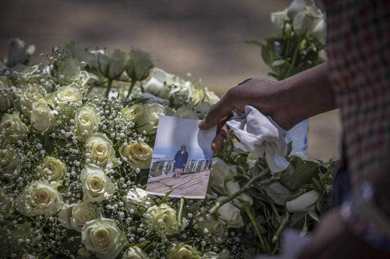 Relatives react at the scene