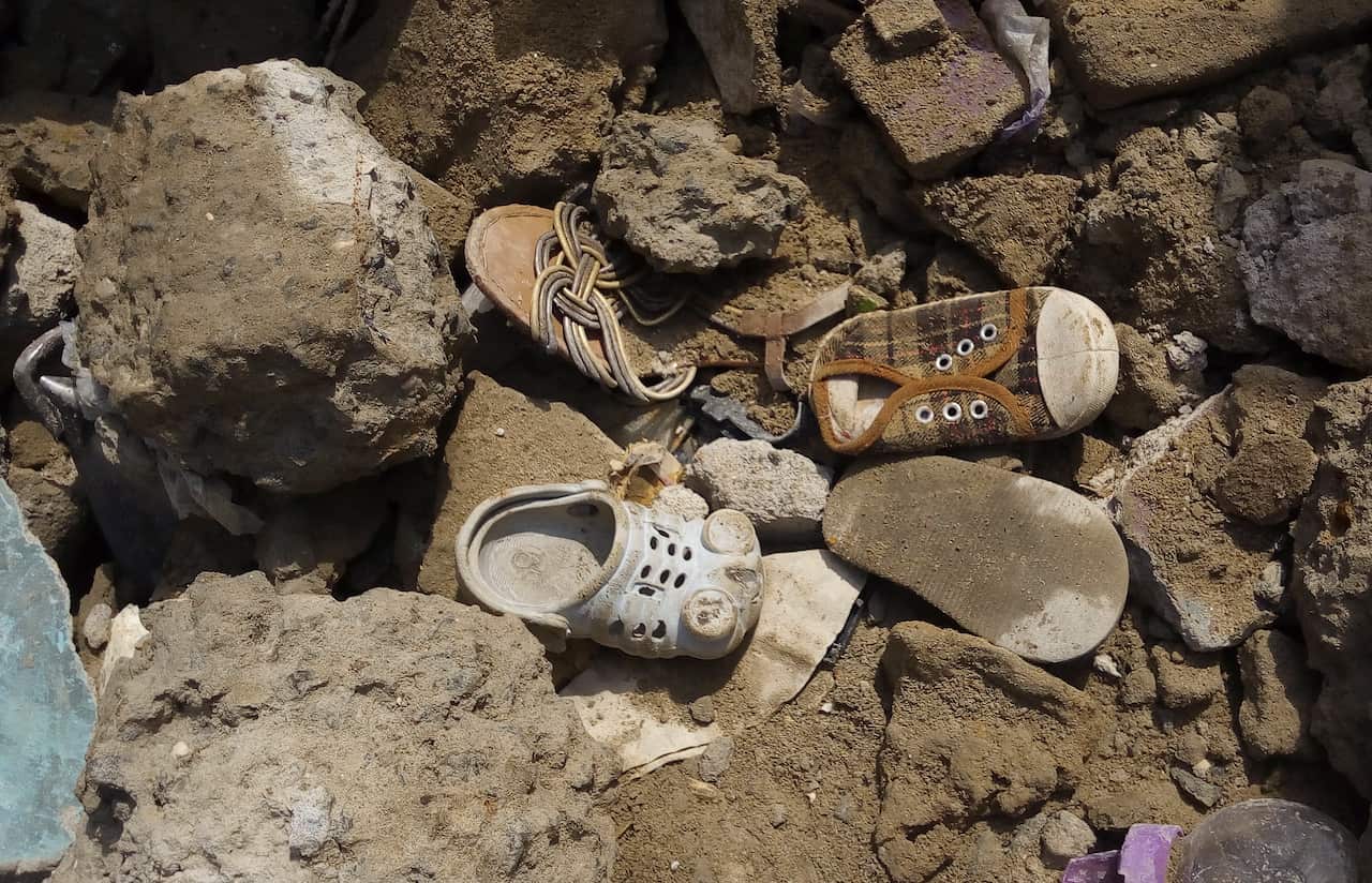 Children shoes are seen among the ruble of a building collapse in Ita Faji, Lagos.