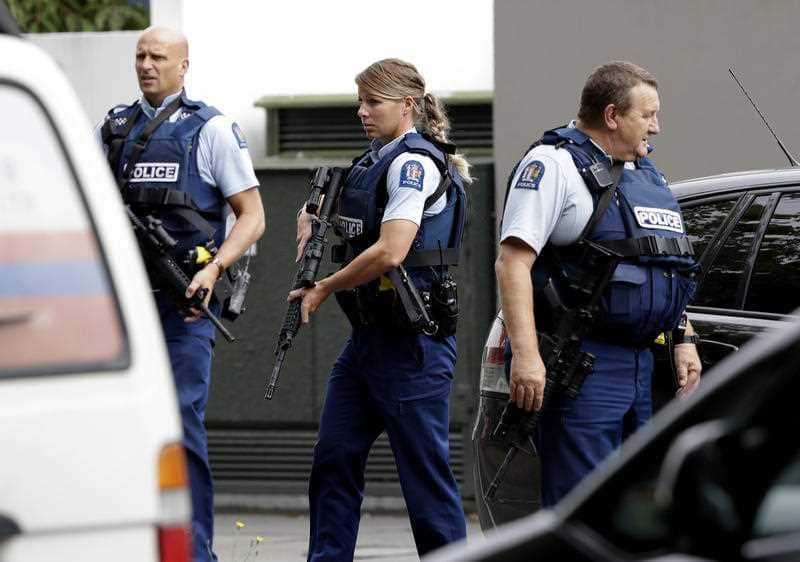 Armed police patrol outside a mosque in central Christchurch.