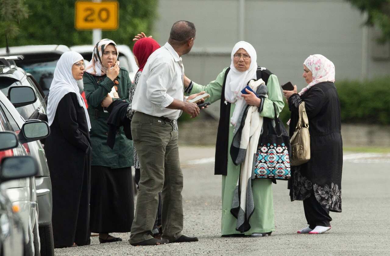 Shocked family outside the mosque after the attack.