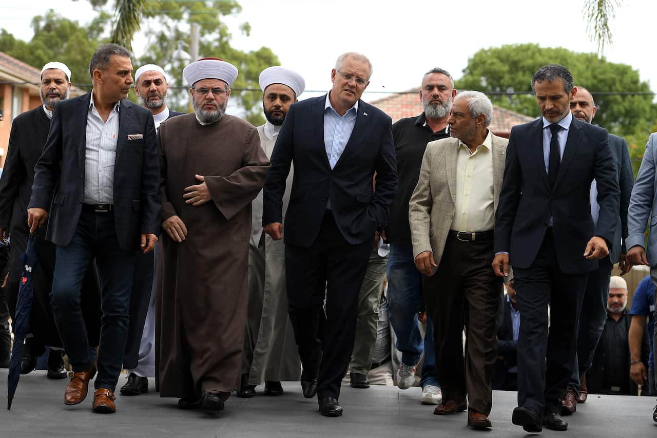 Prime Minister Scott Morrison arrives with Imams and Islamic community leaders following a meeting during a visit to the Lakemba Mosque.