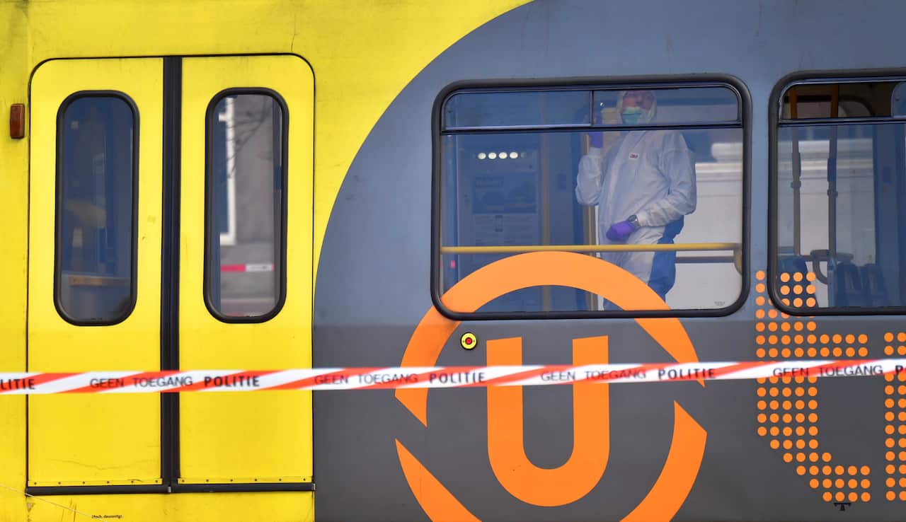 Forensic police search the interior of the tram after a shooting at 24 Oktoberplein, in Utrecht.