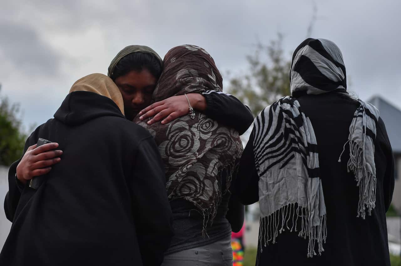 Female Muslim worshipers grieve at a makeshift memorial at the Al Noor Mosque on Deans Rd in Christchurch, New Zealand.
