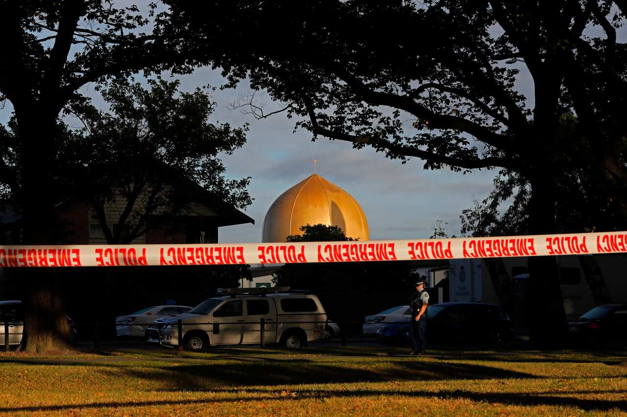 A police officer stands guard in front of the Masjid Al Noor mosque in Christchurch, following the deadly attacks. 