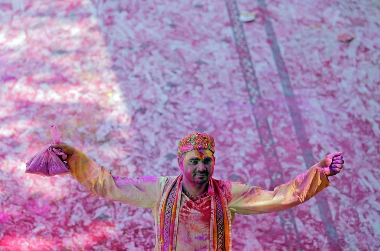 Hindu priest at Holi festival celebrations at Durgiana Temple