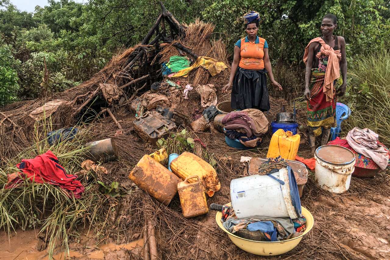 People recover their belongings after the passage of the cyclone Idai in Matarara, Mozambique.