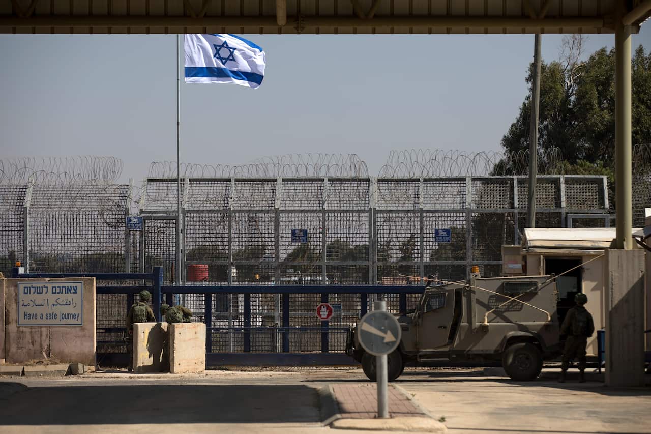 Israeli soldiers stand guard at the Quneitra crossing in the Golan Heights.