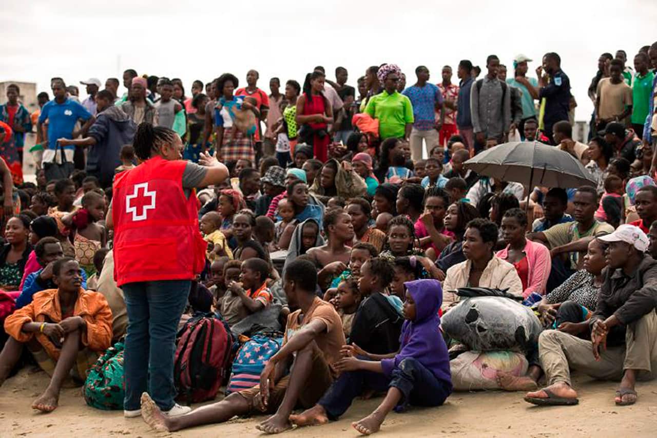 Survivors of Cyclone Idai after their arrival by rescue boat in Beira, Mozambique.