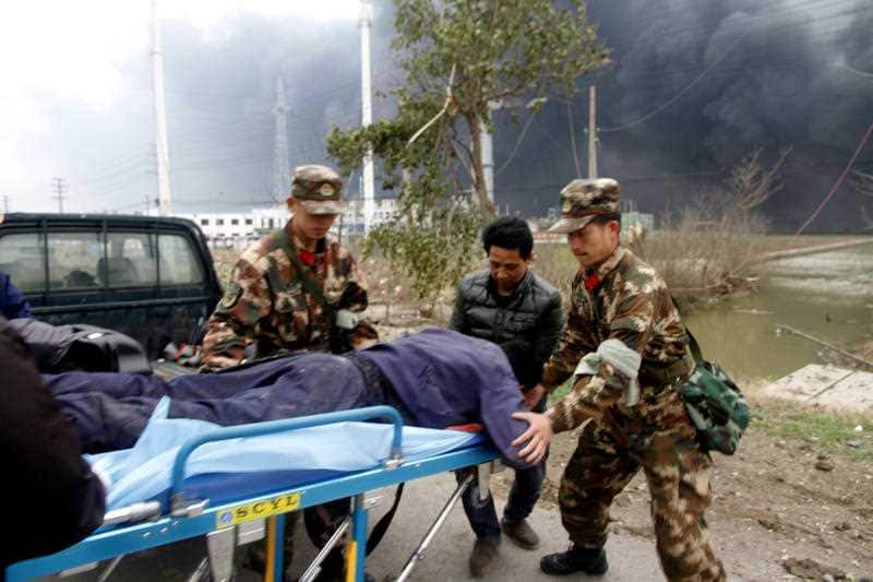 Rescuers transport an injured person following the blast.