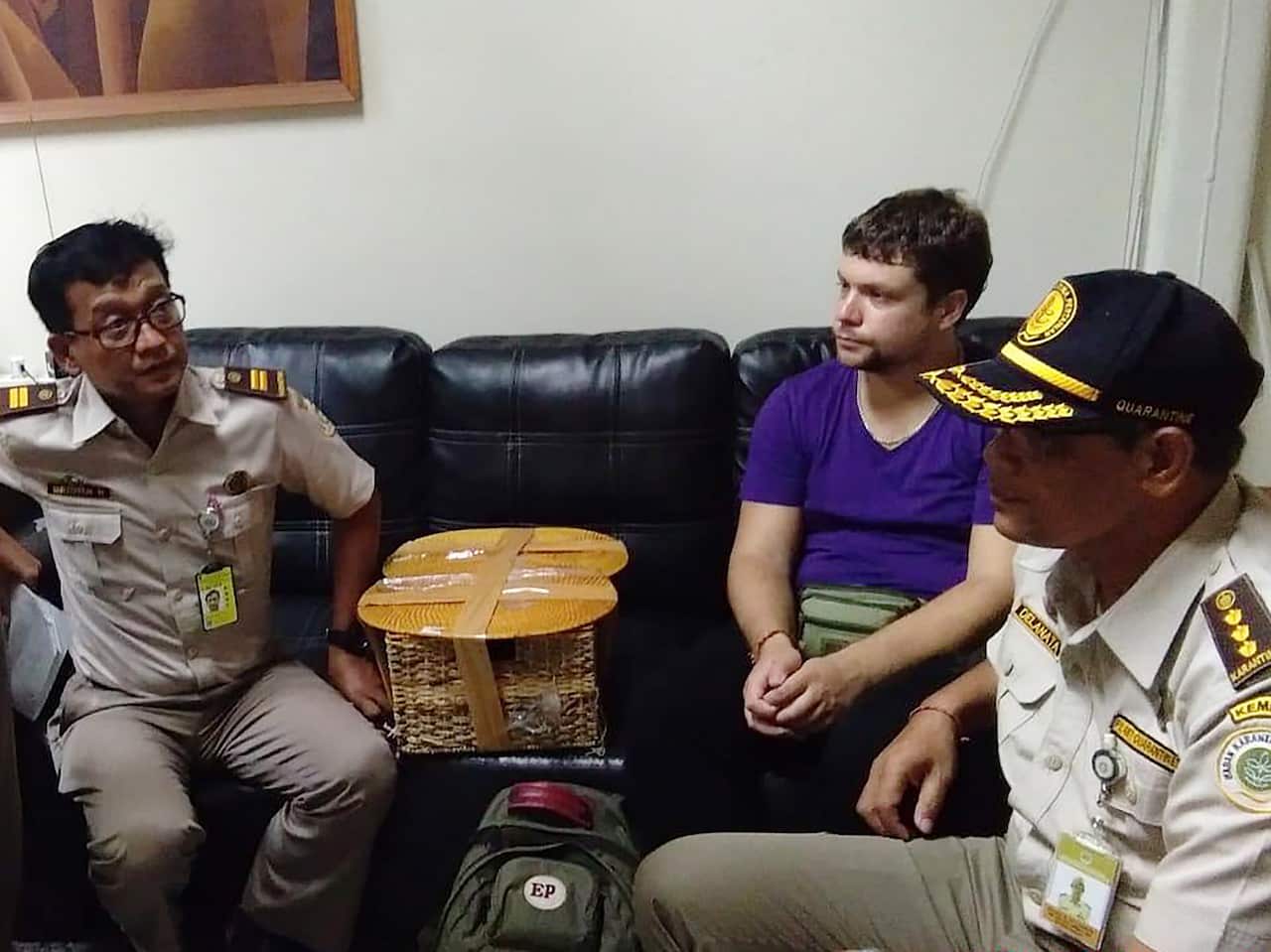 The Russian national with authorities.