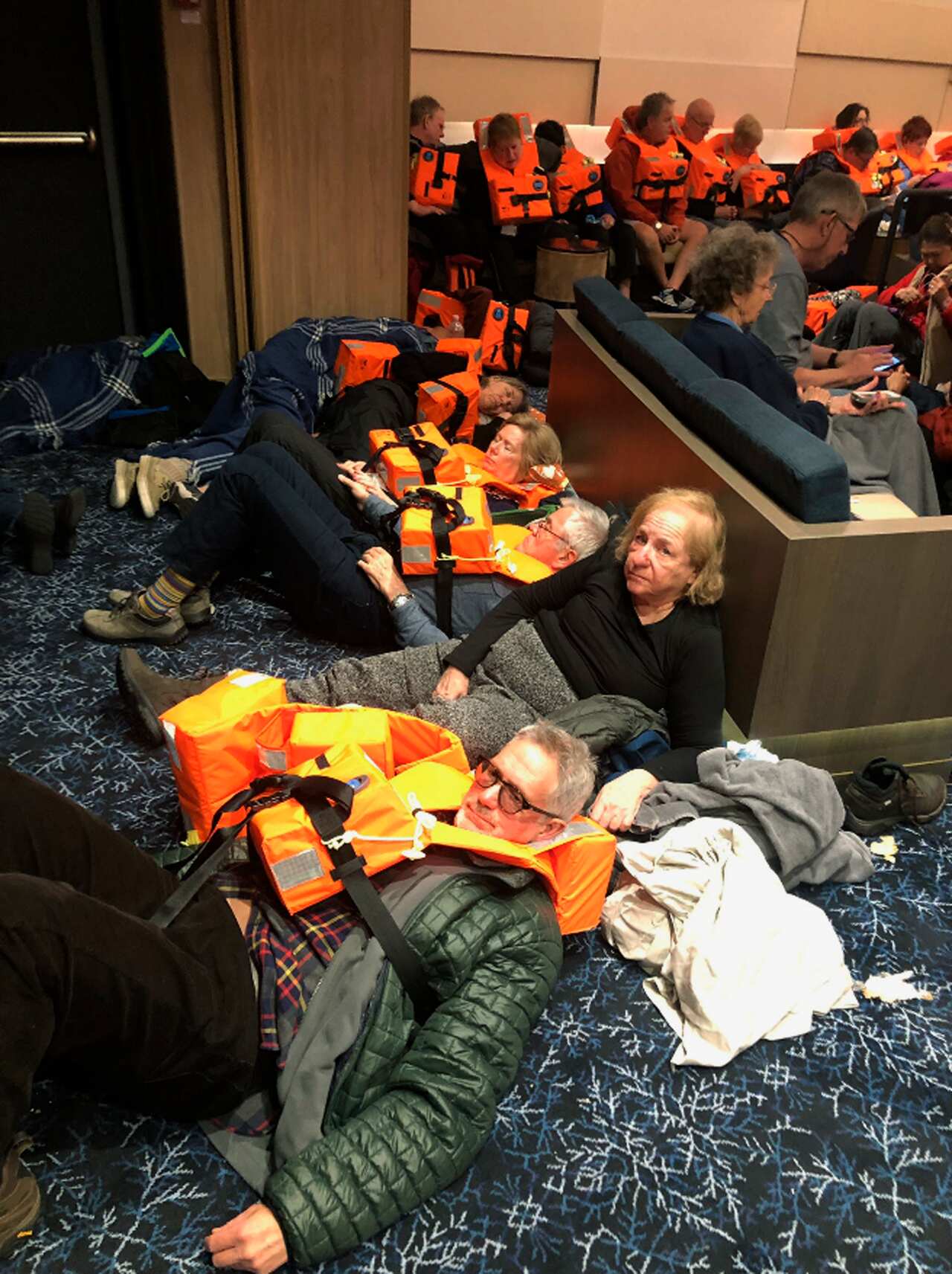 This photo provided by Alexus Sheppard shows passengers on board the Viking Sky, waiting to be evacuated, off the coast of Norway.