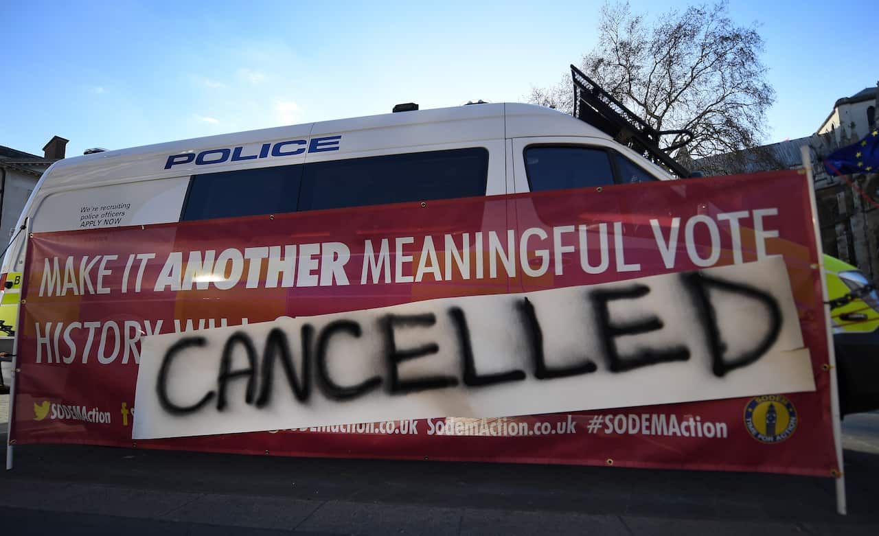 Pro EU campaigners place a banner outside the British Houses of Parliament in London, Britain, 25 March 2019. 