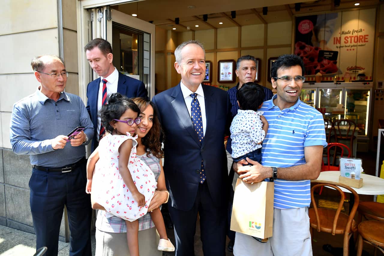 Federal Opposition Leader Bill Shorten and Labor Candidate for Reid Sam Crosby during a street walk at Burwood in Sydney, Tuesday, March 26, 2019. (AAP Image/Joel Carrett) NO ARCHIVING