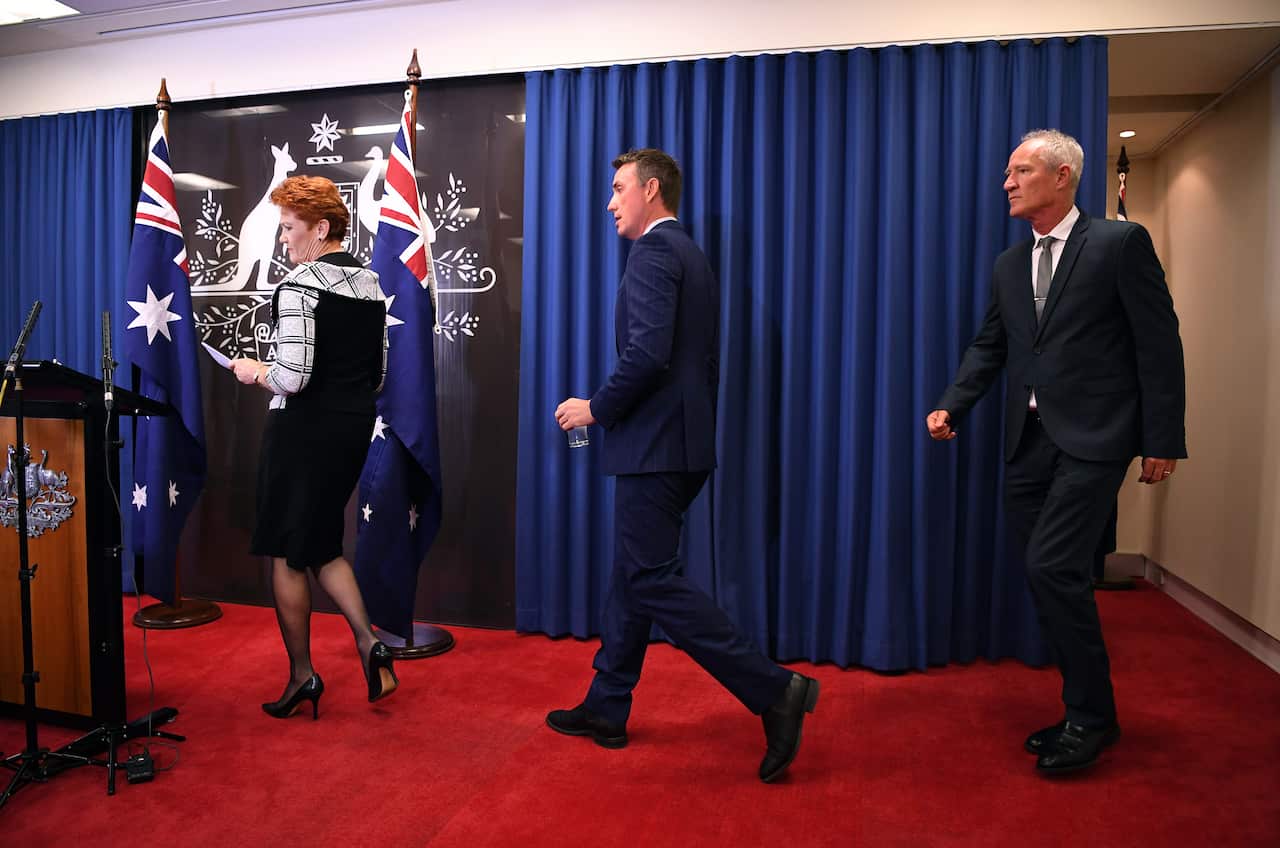 One Nation leader Pauline Hanson arrives at the press conference followed by party officials James Ashby and Steve Dickson. 