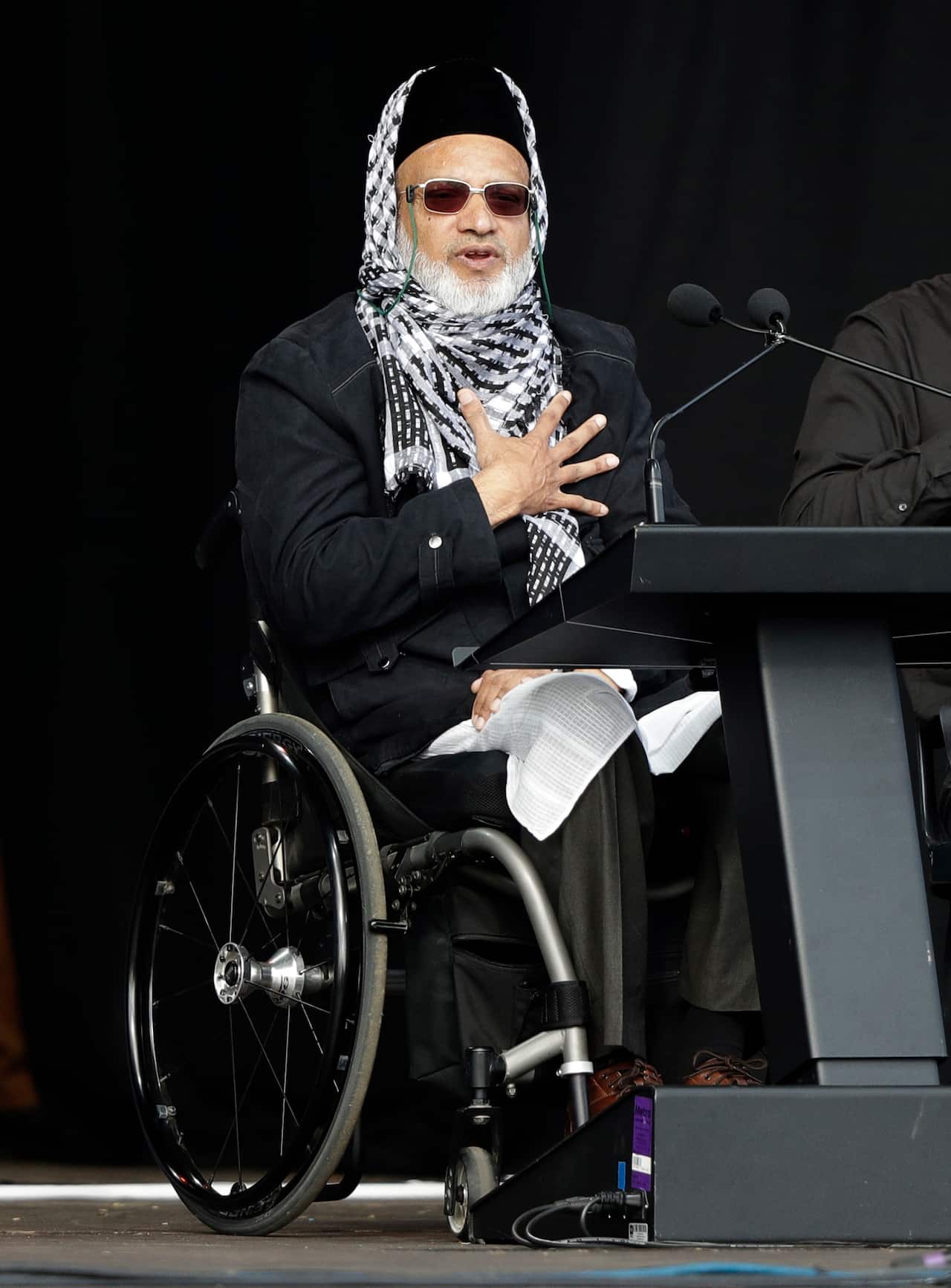 Mosque shooting survivor Farid Ahmed addresses the national remembrance service in Hagley Park for the victims of the March 15 mosques terrorist attack in Christchurch, New Zealand, Friday, March 29, 2019. (AP Photo/Mark Baker)