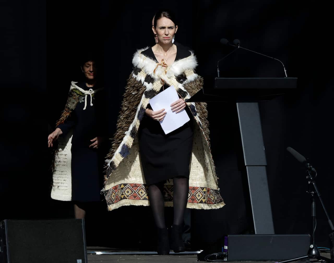 New Zealand Prime Minister Jacinda Ardern walks onto the stage to address a national remembrance service in Hagley Park for the victims of the March 15 mosque terrorist attack in Christchurch, New Zealand, Friday, March 29, 2019. (AP Photo/Mark Baker)