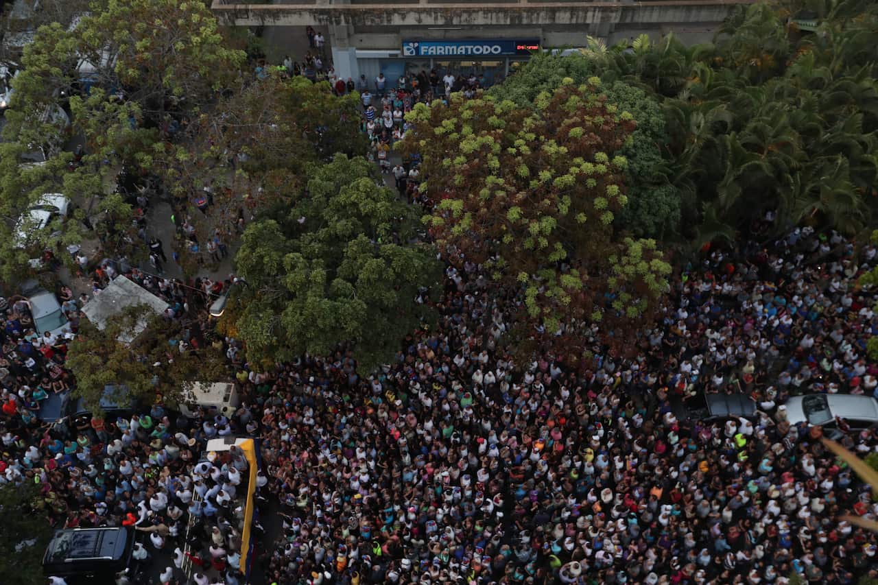 epa07469761 People attend an event of Venezuelan National Assembly President Juan Guaido, in Montalban, south Caracas, Venezuela, 28 March 2019. EPA/RAYNER PENA