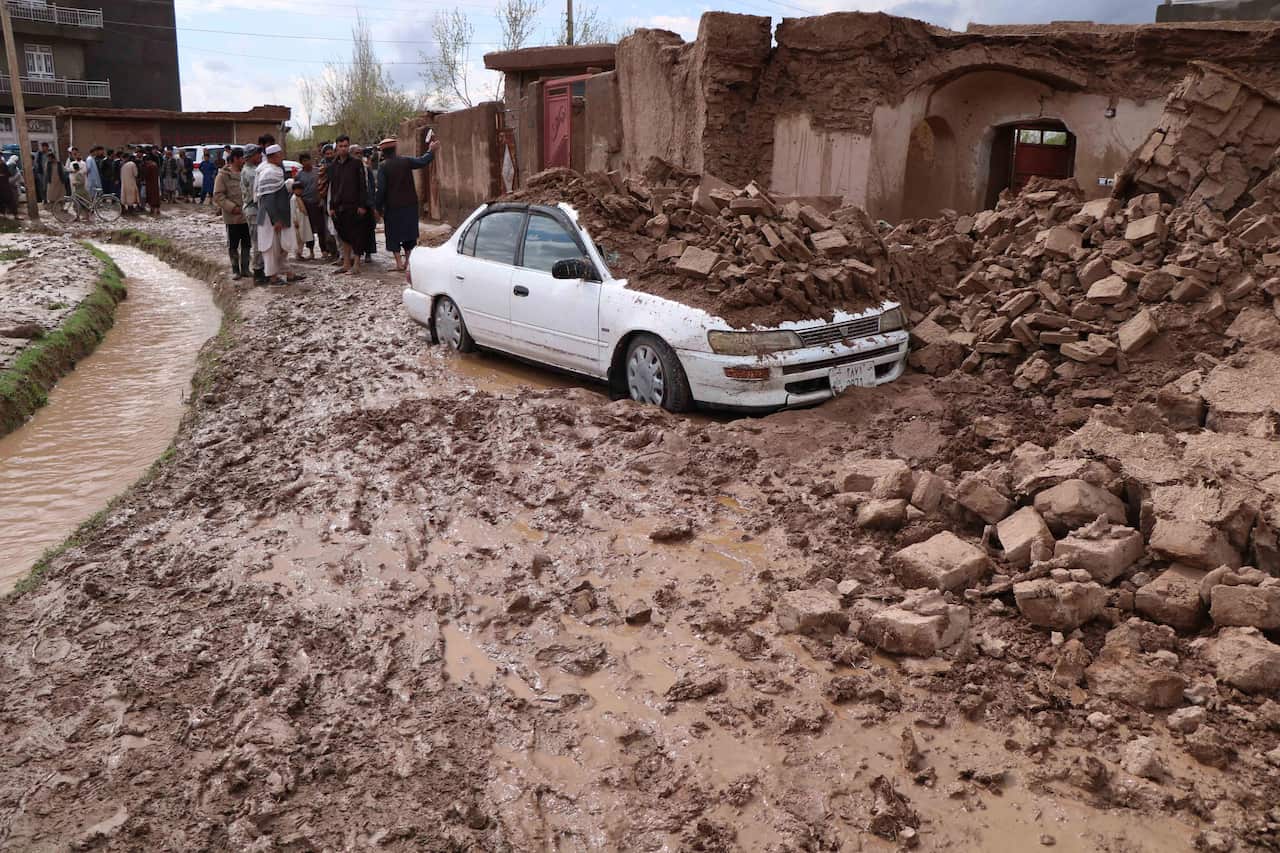 epaselect epa07470691 Afghan people survey their damaged houses after seasonal floods in Herat, Afghanistan, 29 April 2019. According to local reports, at least 24 villagers were killed while dozens injured or missing in flash floods in western province o
