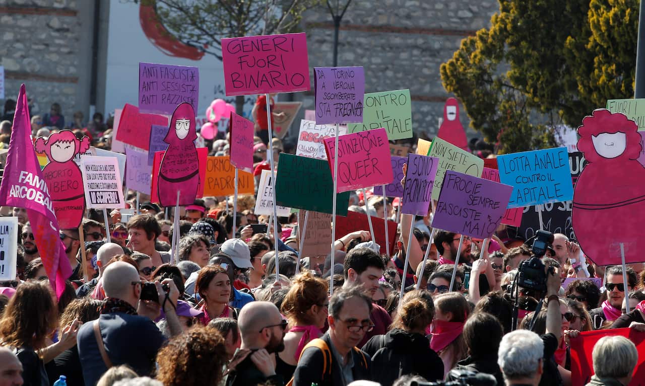 People march to protest the World Congress of Families, in Verona, Italy, Saturday, March 30, 2019. A congress in Italy under the auspices of a U.S. organization that defines family as strictly centering around a mother and father has made Verona the cit