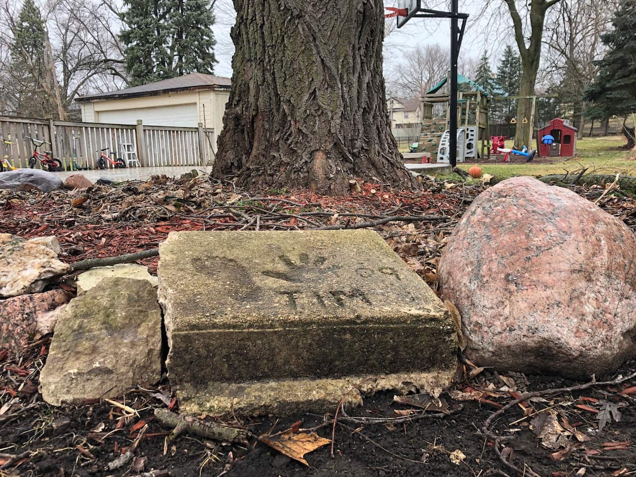 A slab of concrete sits in the backyard of the house where Timmothy Pitzen used to live in Aurora, Illinois.