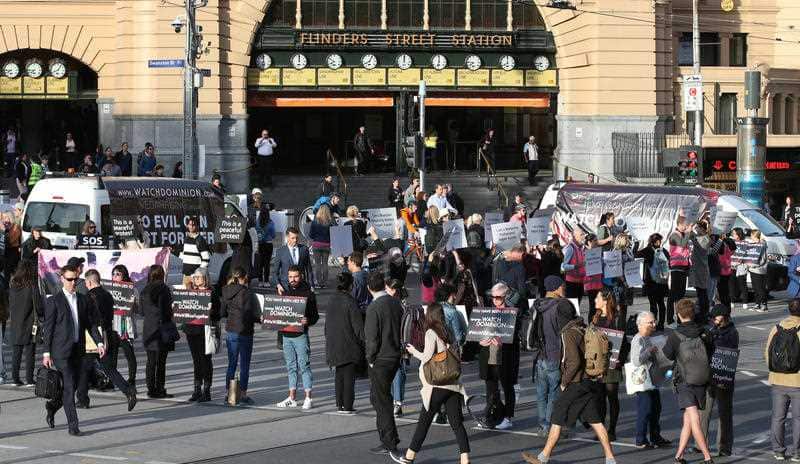 Animal rights protesters block the intersections of Flinders and Swanston Street