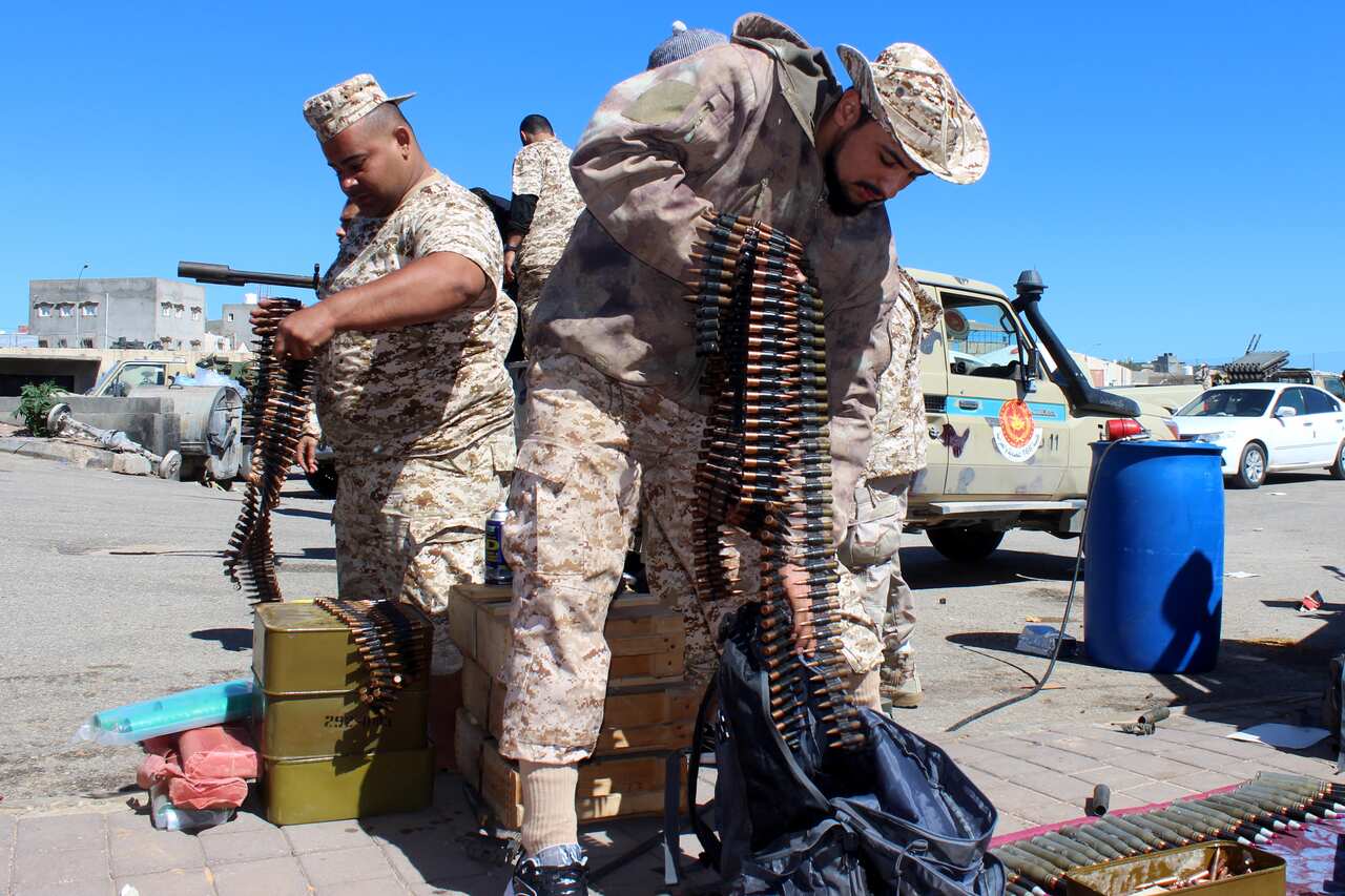 Militants prepare their weapons and ammunition before heading to the frontline to join forces defending the capital, in Tripoli, Libya, 08 April 2019. 