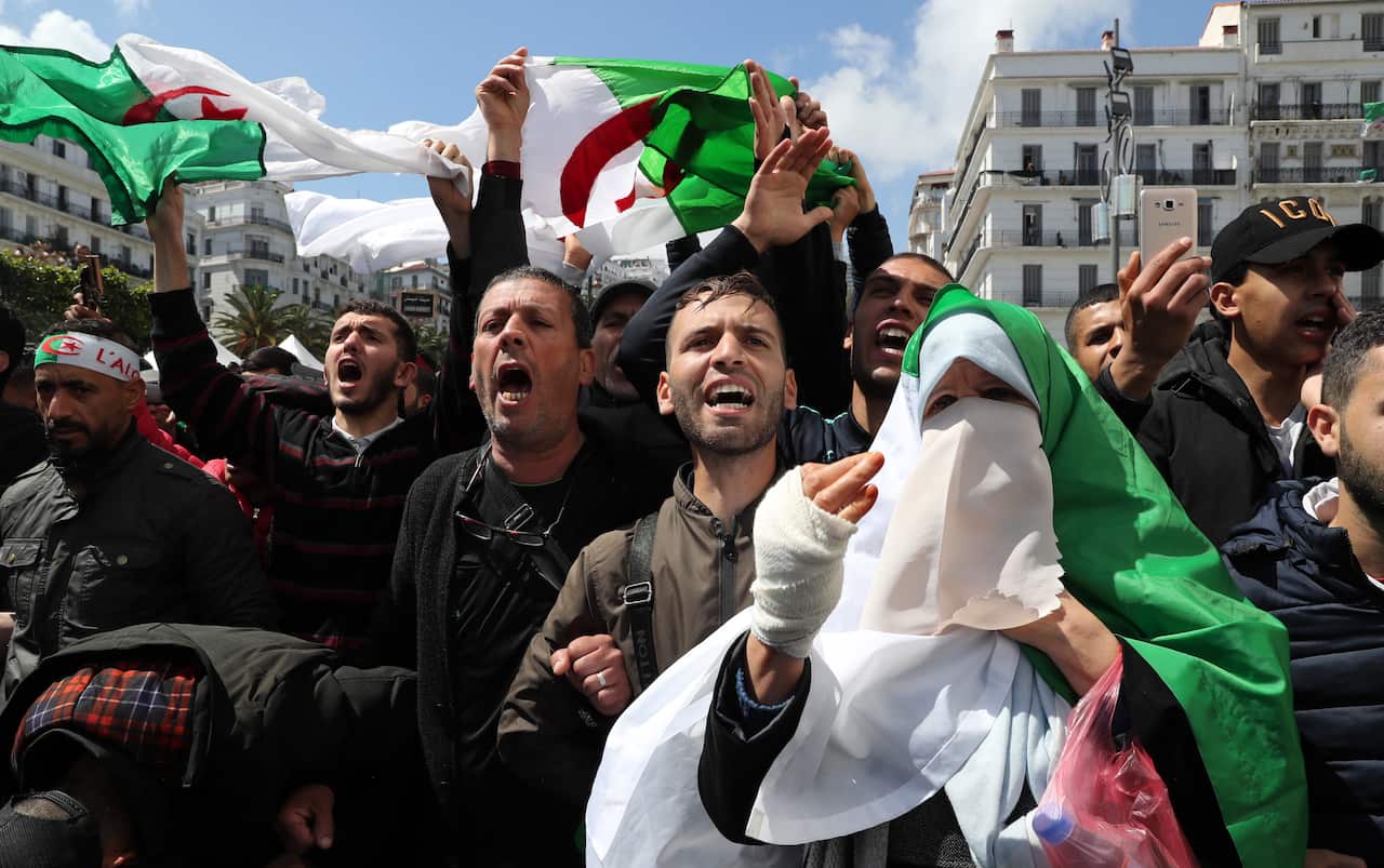 Algerian protesters shout slogans during a protest after parliament named Abdelkader Bensalah as interim president, in Algiers, Algeria.