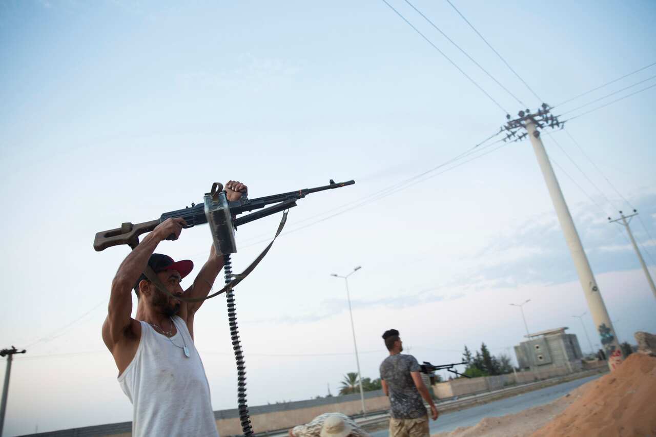 Fighters under the UN-backed government on the front lines during clashes in southern Tripoli. 