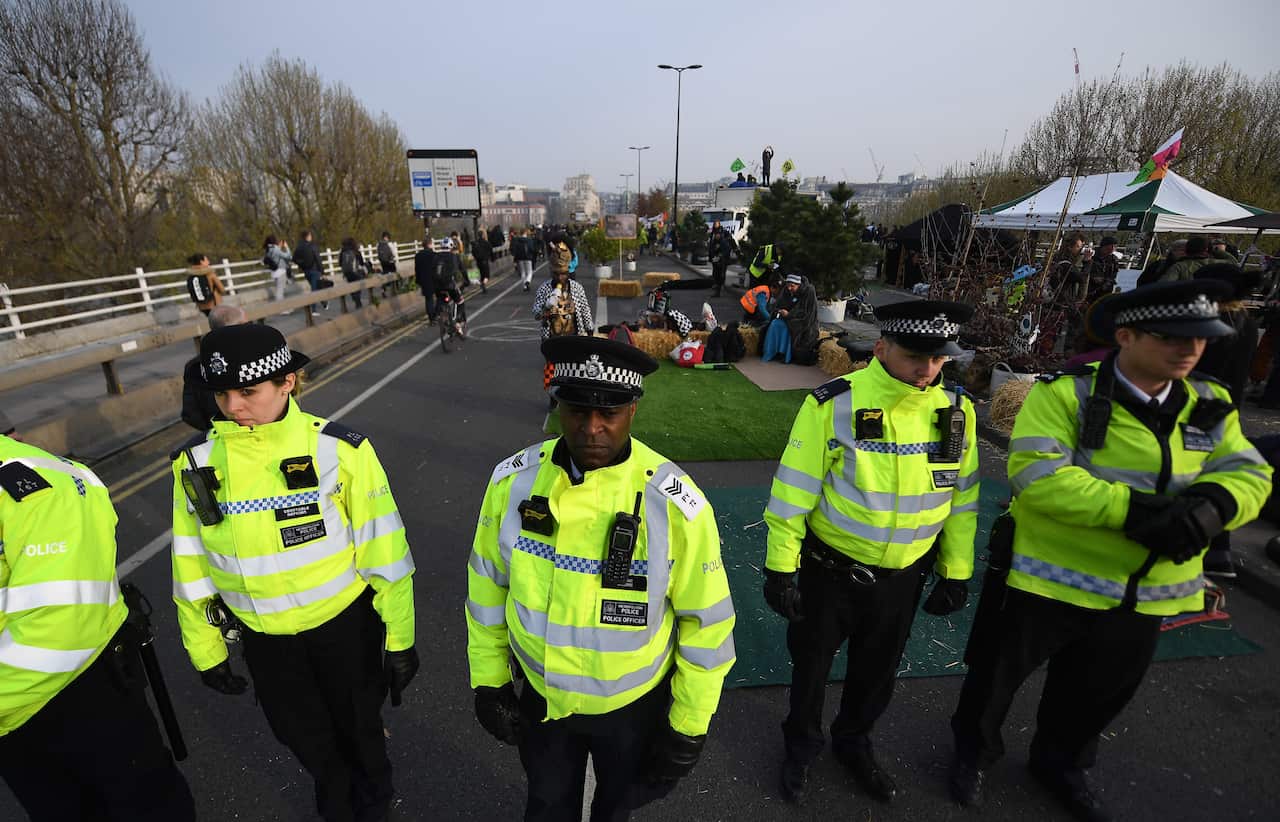 Police on Waterloo Bridge during climate change protests in London.