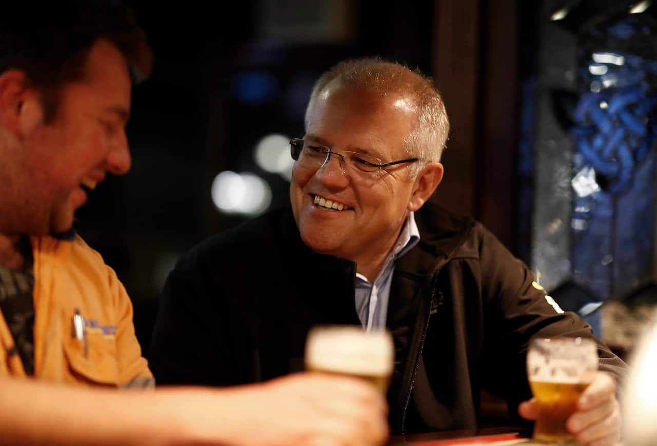 Prime Minister Scott Morrison meets locals at Molly Malone's Irish Pub in Devonport, Tasmania, Wednesday, April 17, 2019. (AAP Image/GETTY IMAGES/POOL/Ryan Pierse)