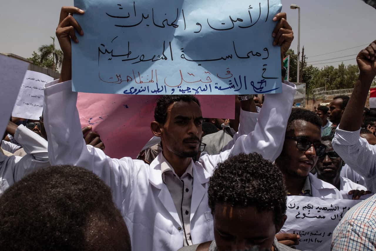 A man holding a banner in the sit-in inside the Armed forces square, Khartoum, Sudan.