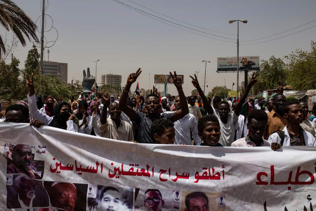 A protesters holding a banner writing in the sit-in inside the Armed forces square, Khartoum, Sudan.