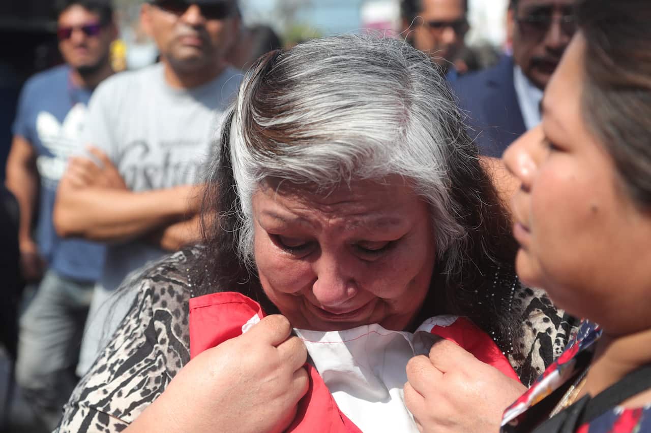 Sympathizers of the American Popular Revolutionary Alliance react after learning of the death of Peruvian former president Alan Garcia Lima, Peru.