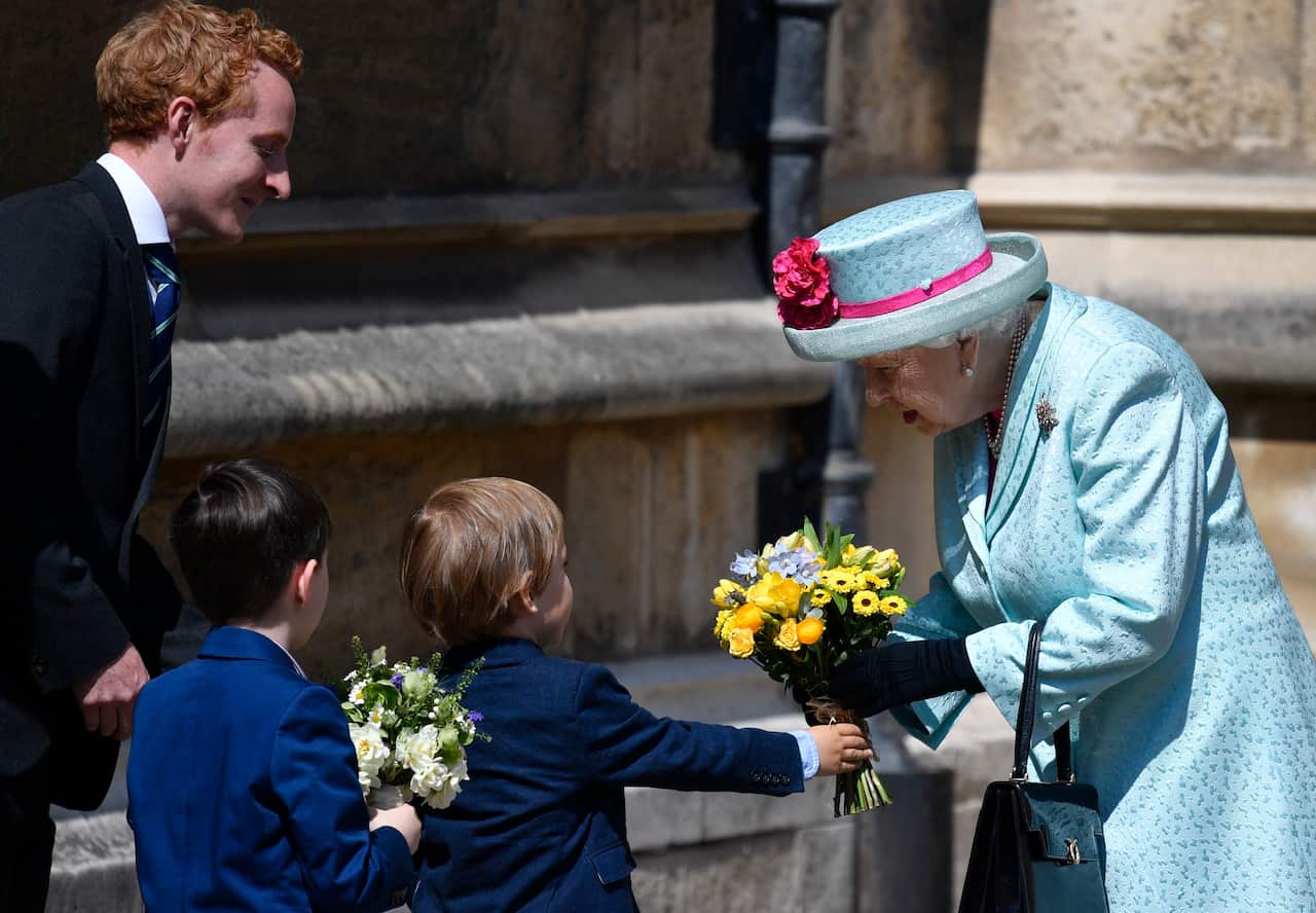 Britain's Queen Elizabeth receives flowers from children on her 93rd birthday in 2019