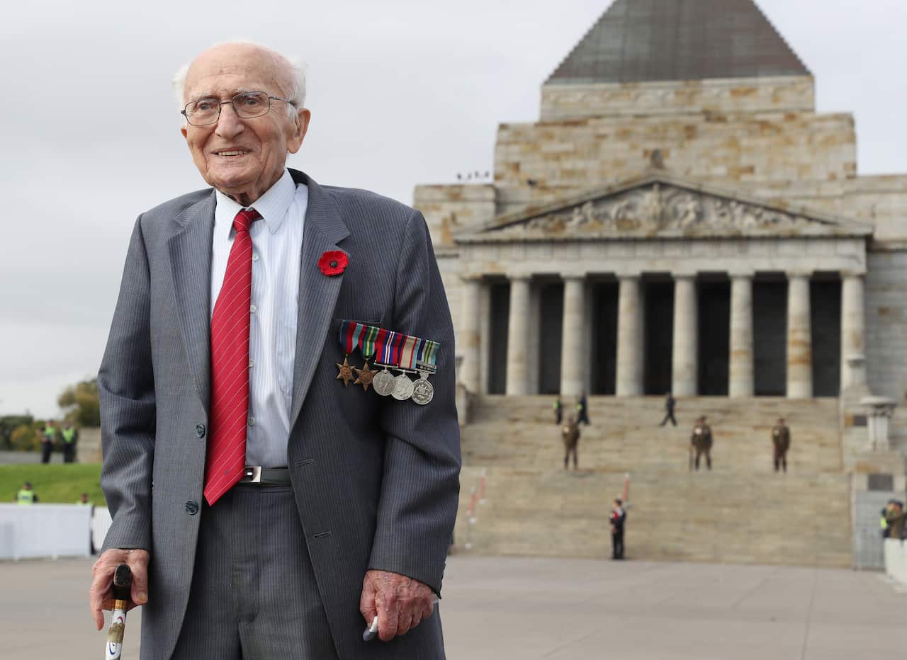 Second World War veteran Sam Krycer, 100, stands in front of the Shrine of Remembrance in Melbourne.