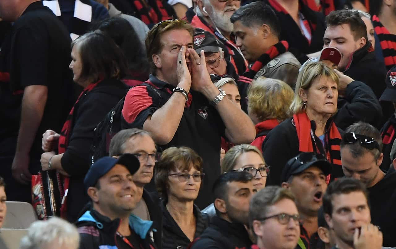 Fans of the Bombers boo after the Magpies won the Round 6 AFL match between the Essendon Bombers and the Collingwood Magpies at the MCG in Melbourne, Thursday, April 25, 2019. (AAP Image/Julian Smith) NO ARCHIVING, EDITORIAL USE ONLY