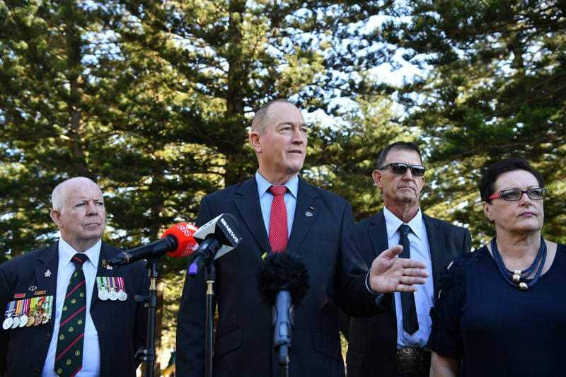 Senator Fraser Anning (centre) is joined by candidate for the seat of Cook Peter Kelly (left) at Dunningham Park at Cronulla 