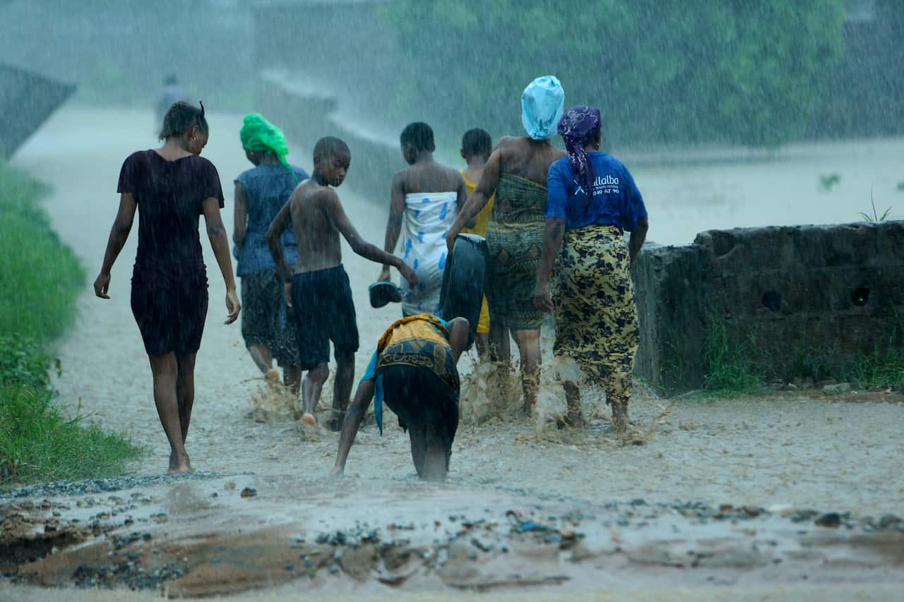 Families whose homes were flooded move to higher ground in Pemba city on the northeastern coast of Mozambique.