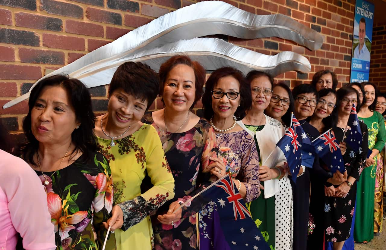 Migrants from Vietnam wait for Prime Minister Scott Morrison and Liberal candidate for Cowan Issac Stewart to arrive at in April.