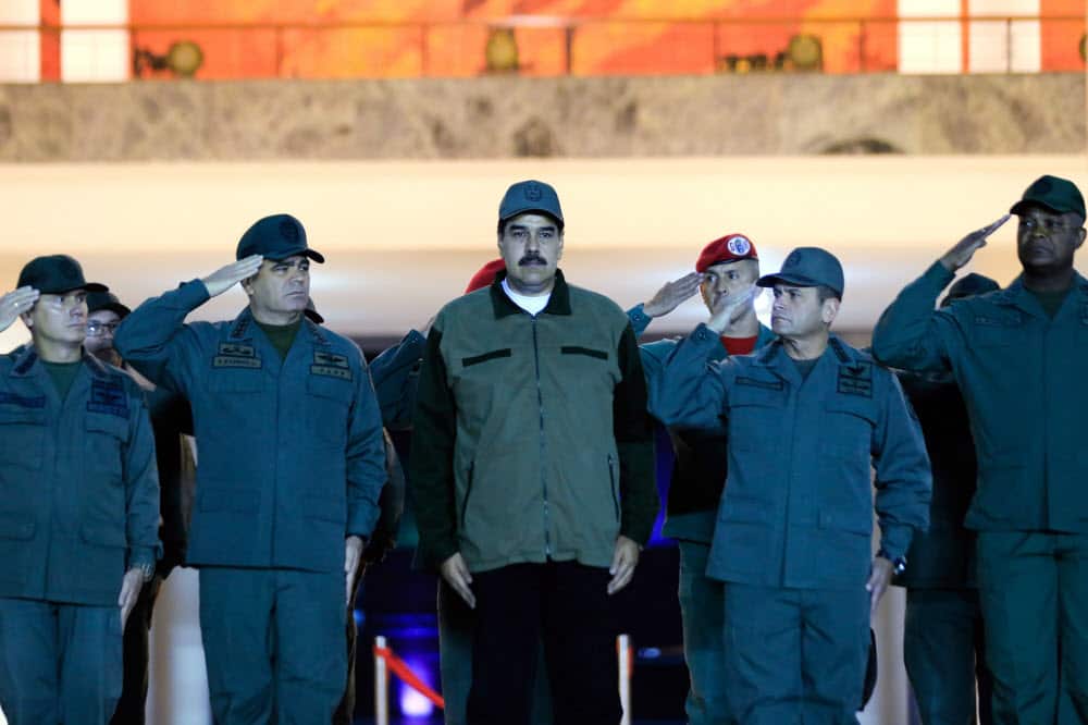 A photo made available by the press office of Miraflores shows Nicolas Maduro at a ceremony with members of the National Bolivarian Armed Forces of Venezuela.