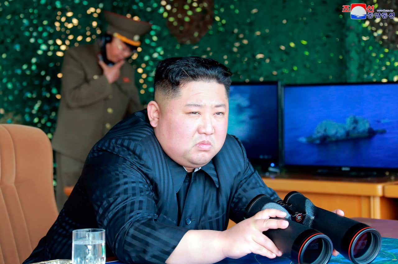 North Korean leader Kim Jong-un supervising a 'strike drill', reportedly testing long-range multiple rocket launchers.