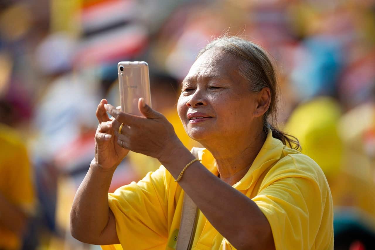 A wellwisher snaps the new king.