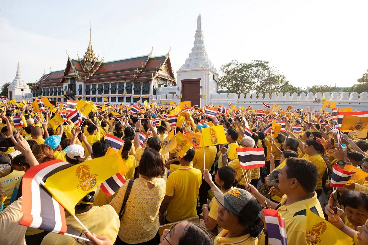 Wellwishers cheer Thailand's King Maha Vajiralongkorn.