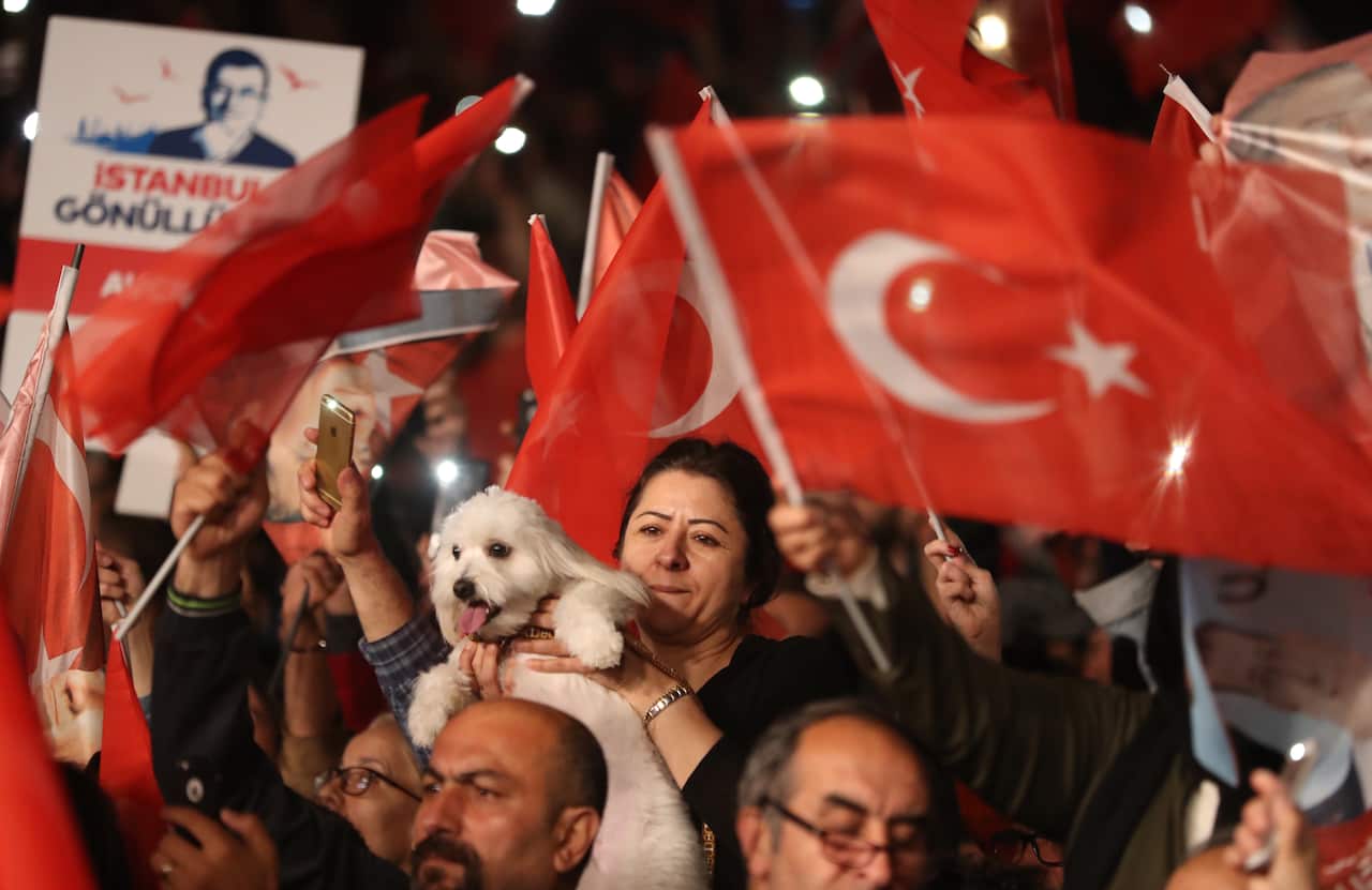 Supporters of Ekrem Imamoglu cheer as they wait for him during a protest against the rerun of elections in Istanbul.