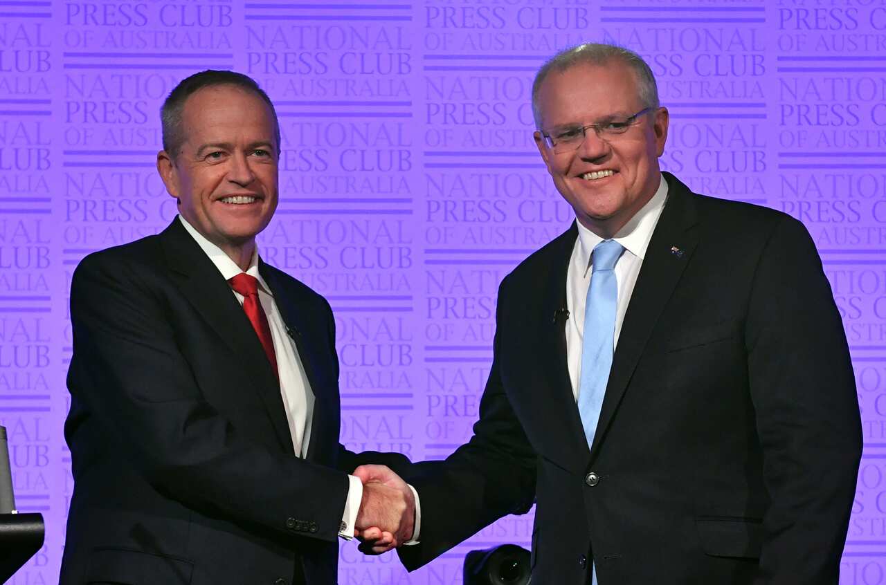 Leader of the Opposition Bill Shorten and Prime Minister Scott Morrison shake hands before the third Leaders Debate at the National Press Club in Canberra, Wednesday, May 8, 2019. (AAP Image/Mick Tsikas) NO ARCHIVING