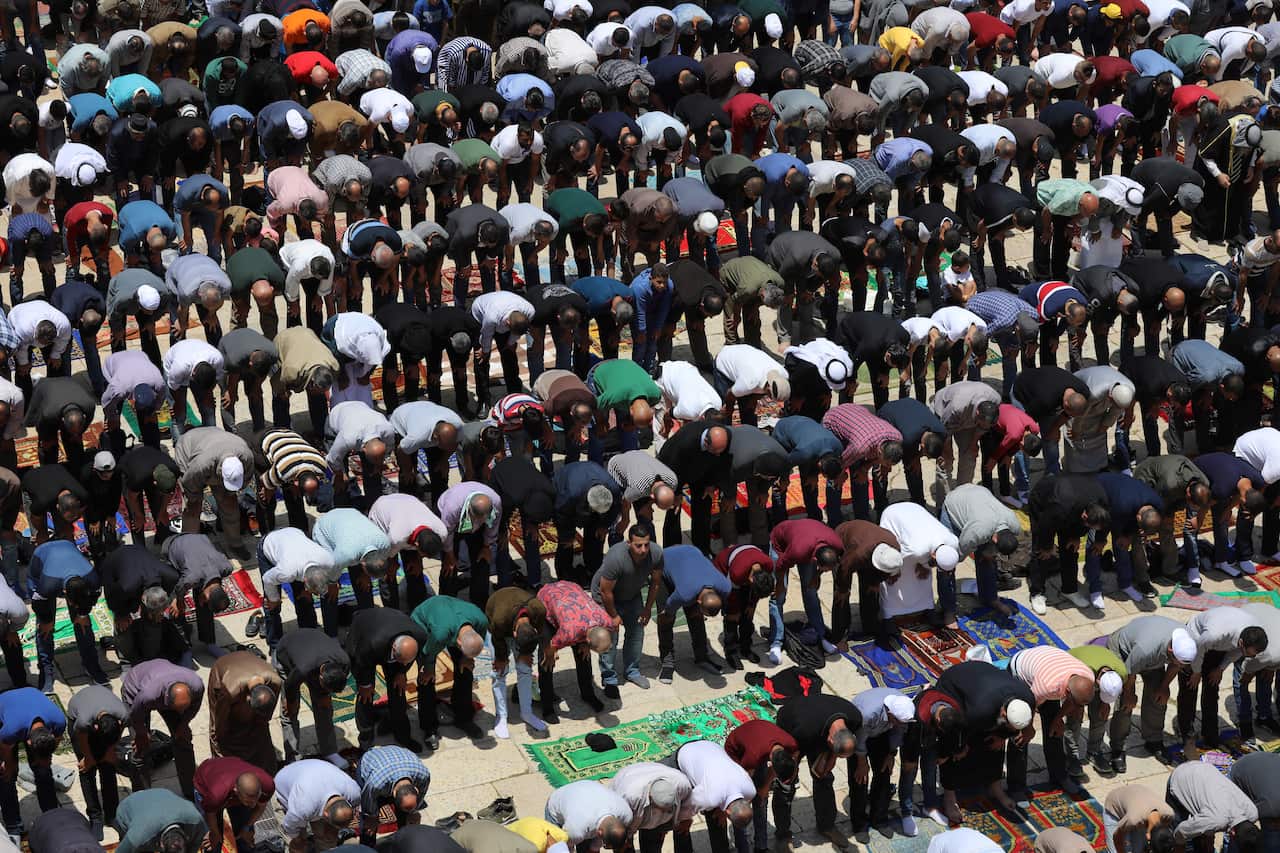 Palestinian worshipers pray outside of the Dome of the Rock at the al-Aqsa mosque compound in Jerusalem, during the Holy month of Ramadan.