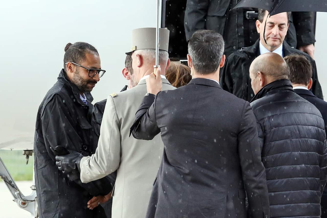 Dignitaries arrive to greet hostages.